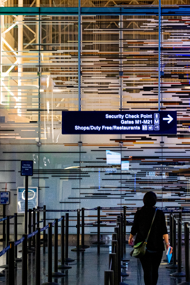 person walking through an airport