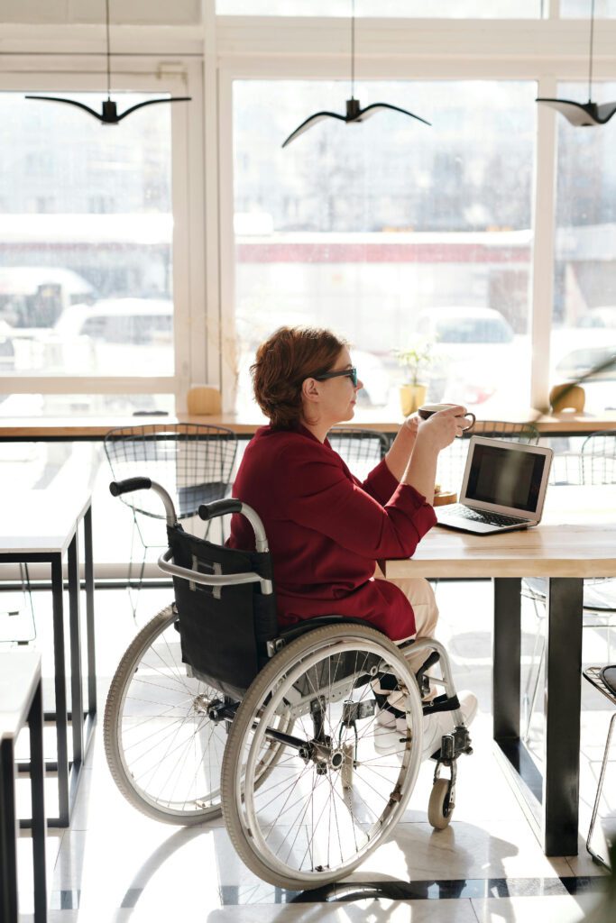 a woman in a wheelchair at work