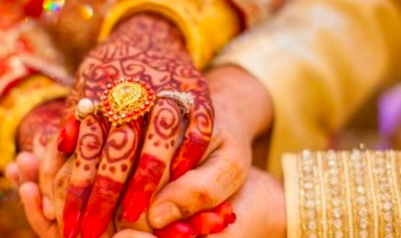 hands painted with henna