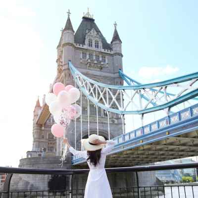 woman with balloons at Tower Bridge