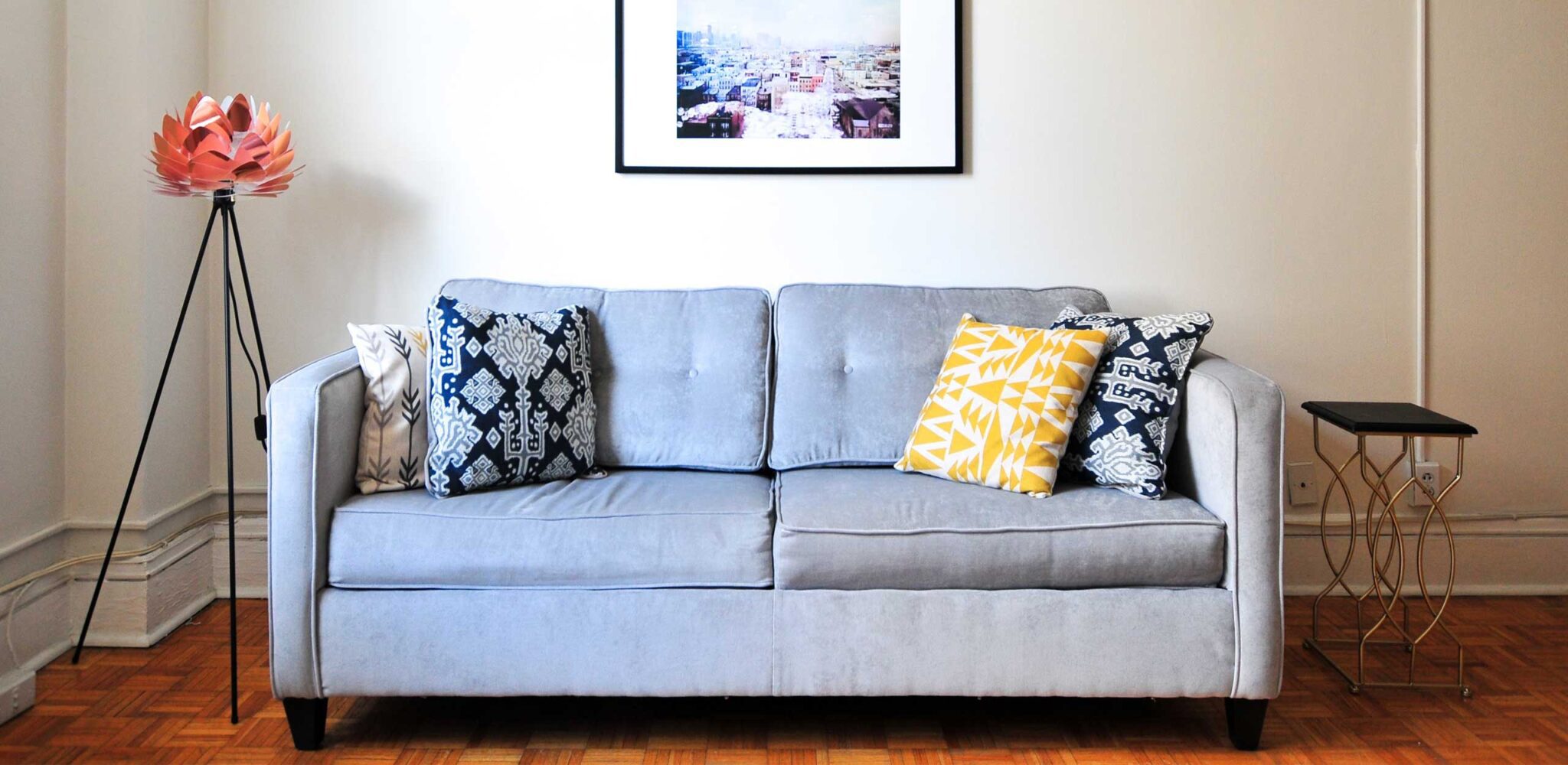 a gray sofa in a furnished apartment