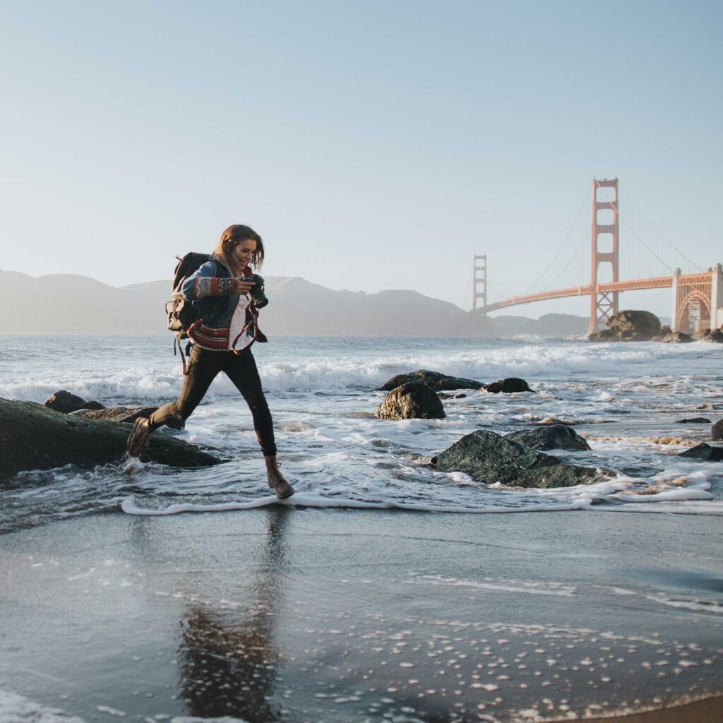 woman trekking on the beach