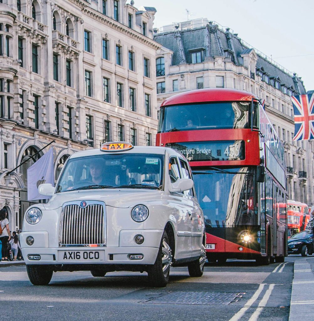 a taxi and a double decker bus