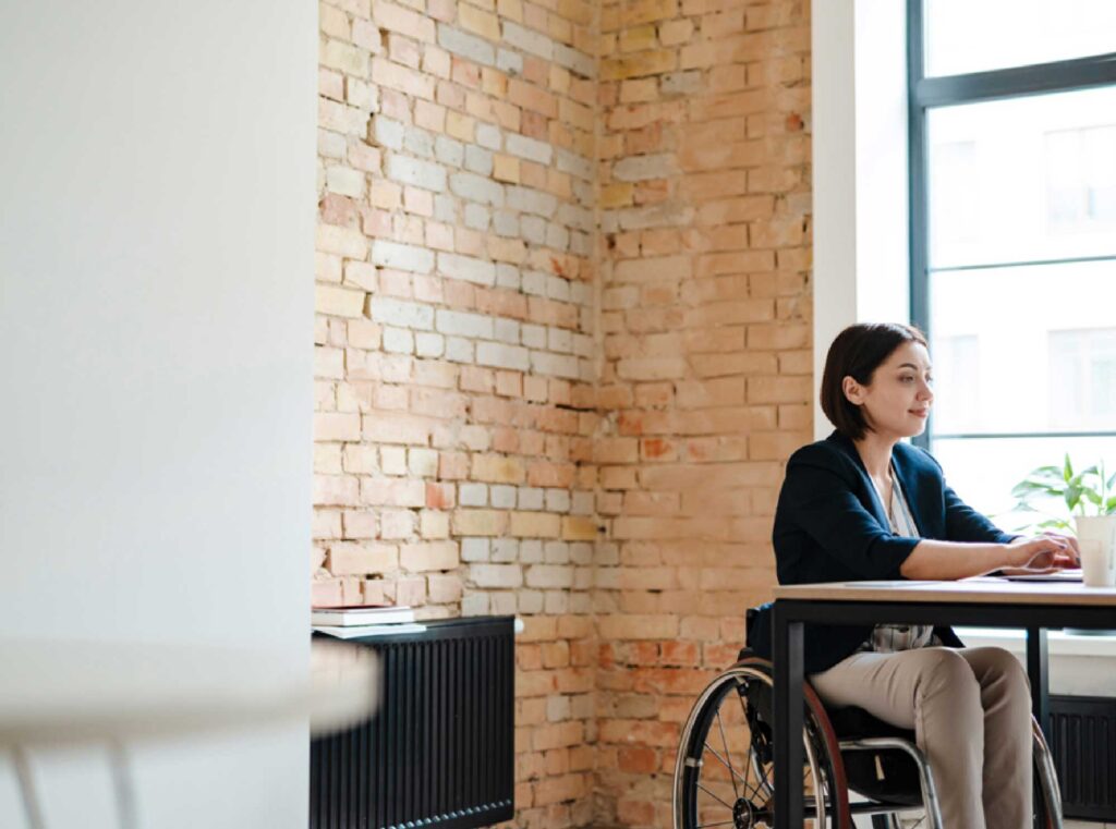 a woman in a wheelchair at work