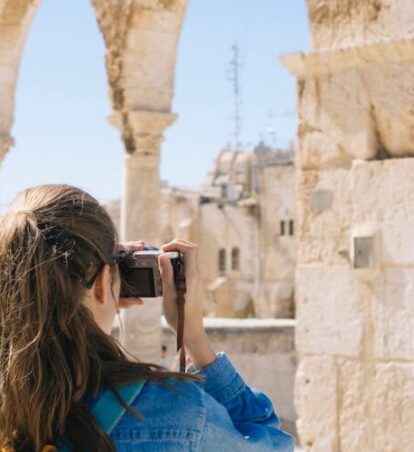 a person taking pictures in Rome