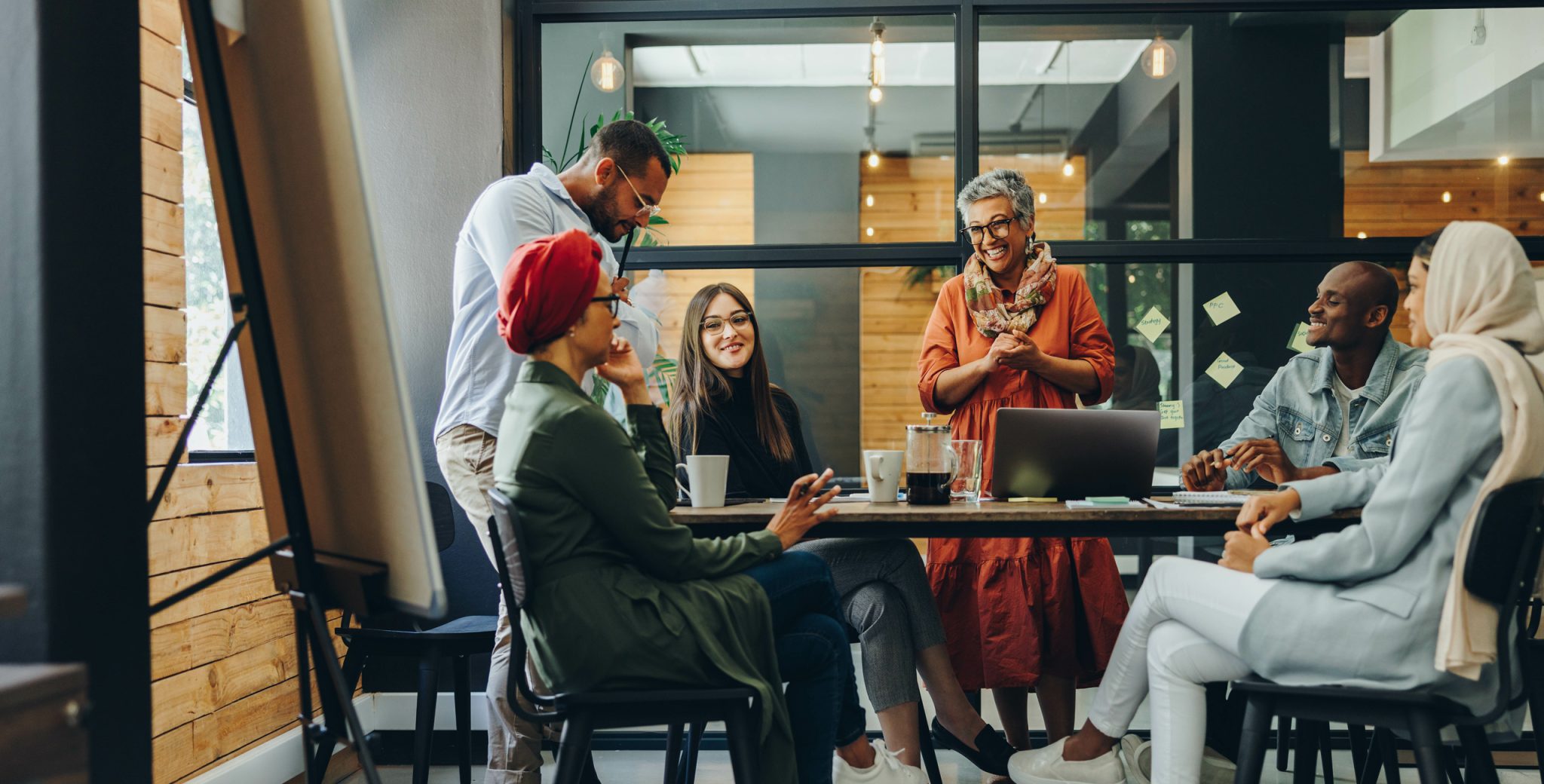 a diverse group of people meeting at work