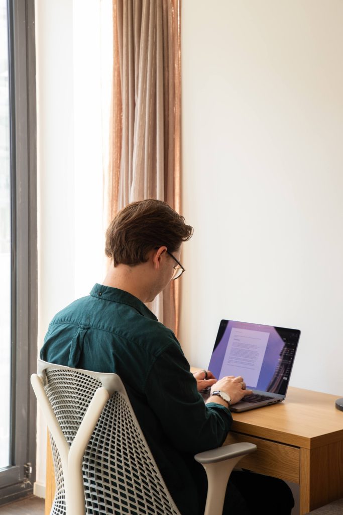 Man working in a Synergy apartment