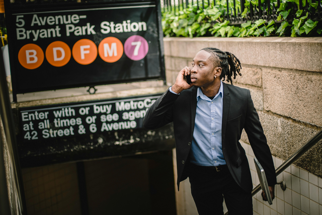 Corporate worker taking a call while walking.