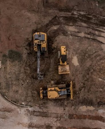 Aerial Photo Of Excavator, Road Roller, And Bulldozer