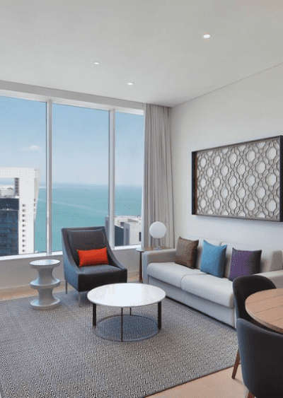 Aleph Doha Residences Living Room With View Of The Water.