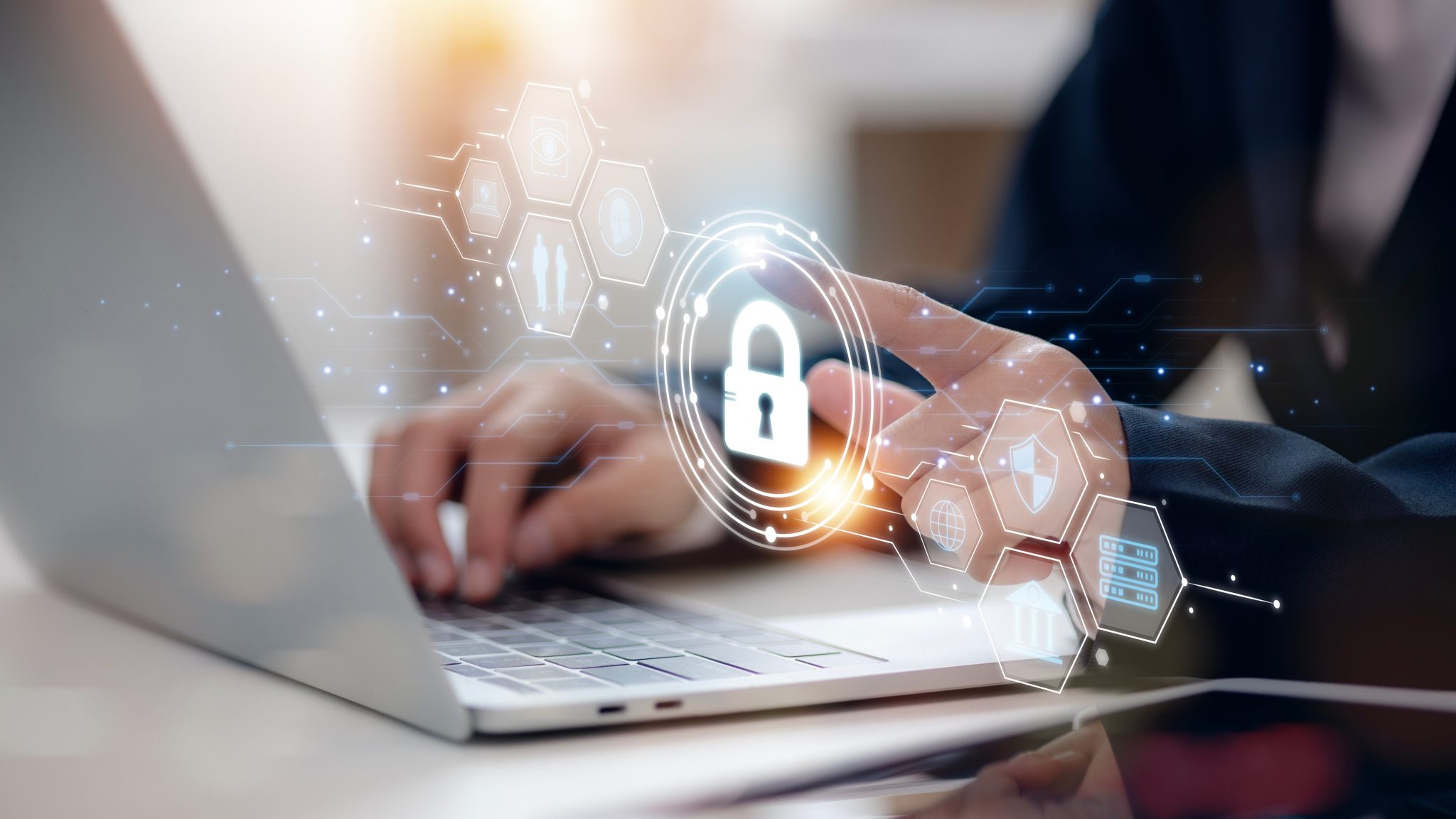 Woman on the computer with cyber security holograph