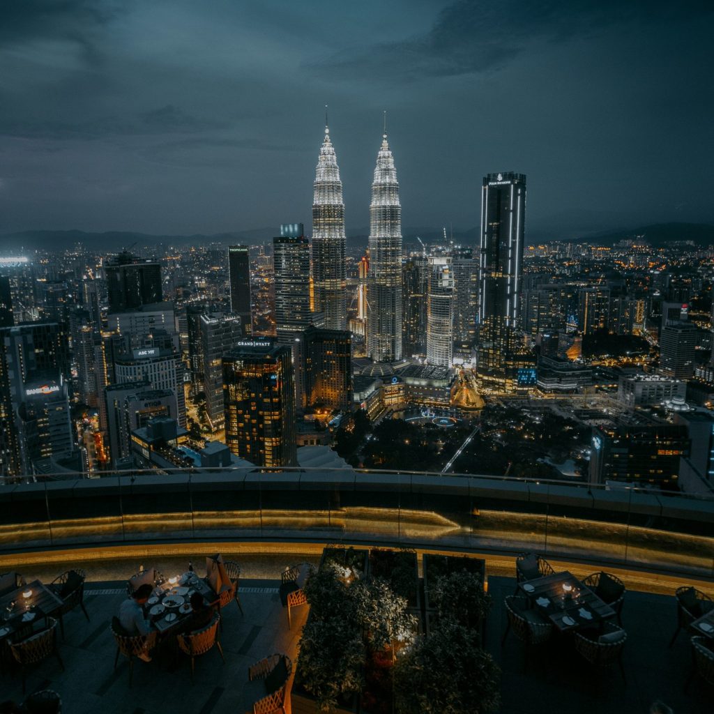 city with high rise buildings during night time.