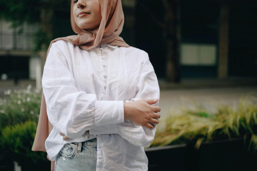 A Woman in Hijab While Arms Crossed.