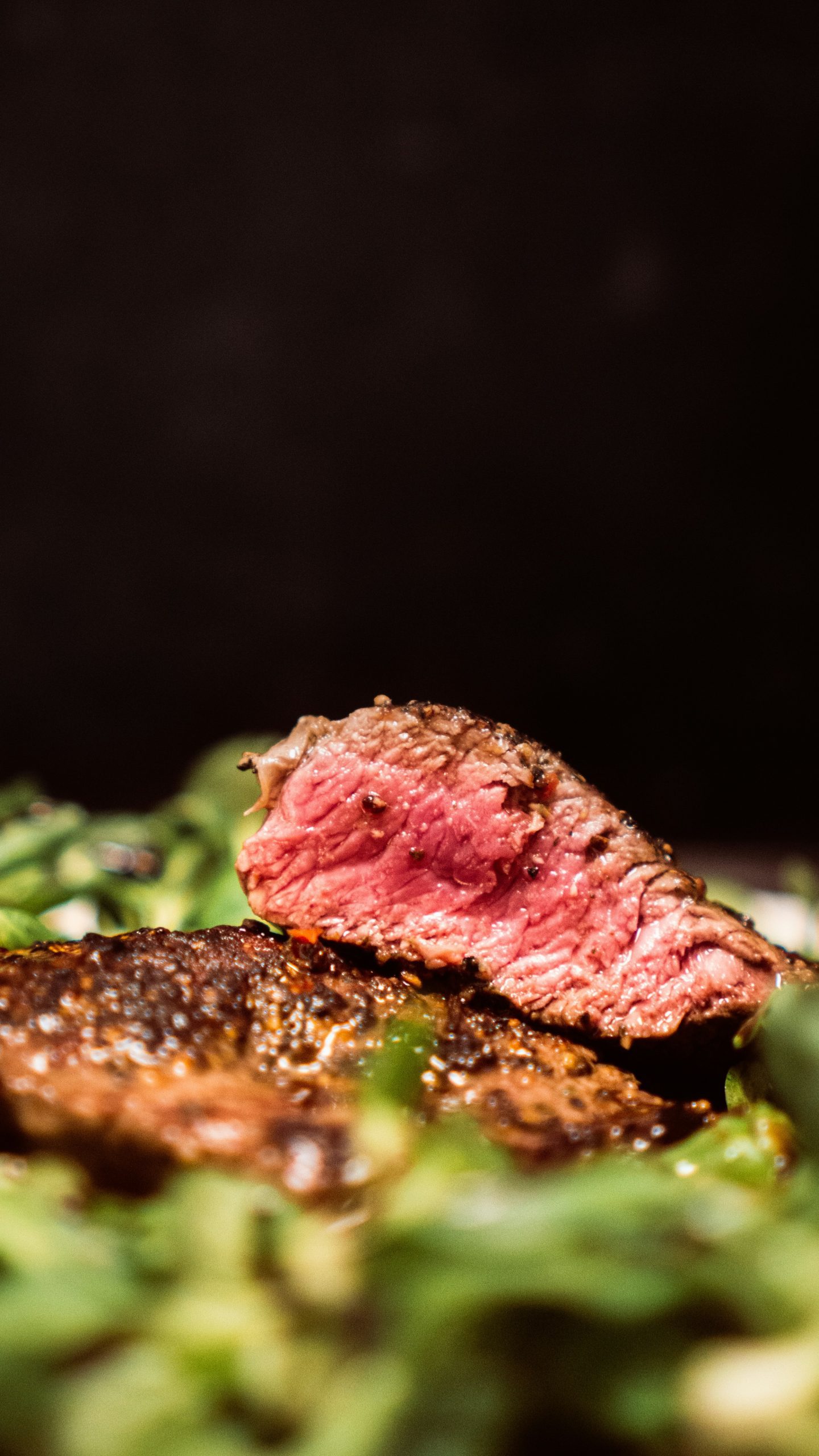 rare steak cut on dish.